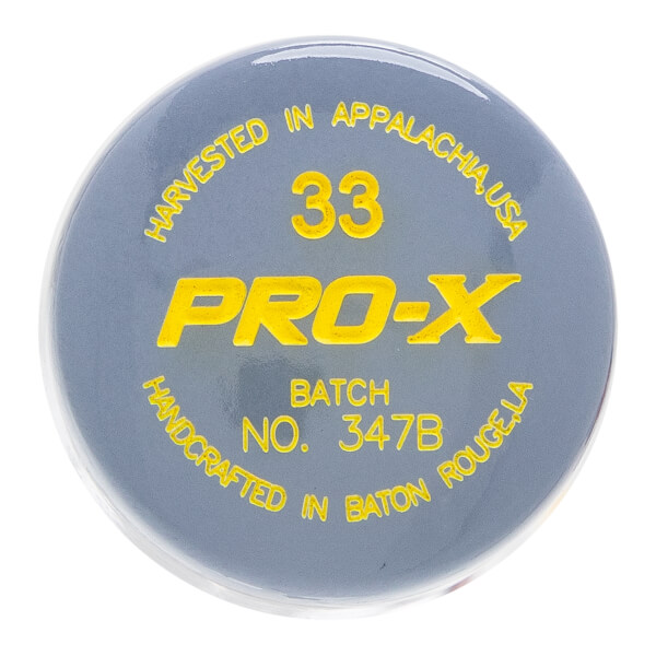 Top-down view of a gray baseball bat puck with yellow PRO-X text, 33, and HARVESTED IN APPALACHIA, USA.