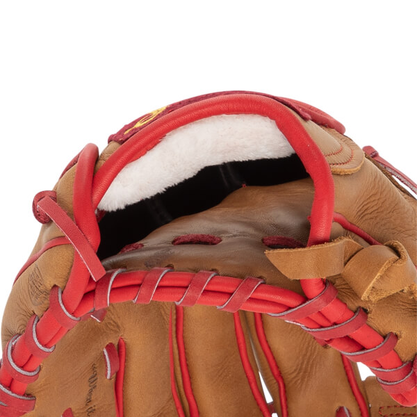 Close-up of a tan baseball glove with a white plush wrist lining and red leather lacing.