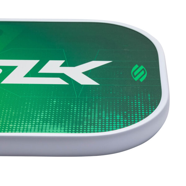 Corner view of a green pickleball paddle with white SLK text and a green logo.