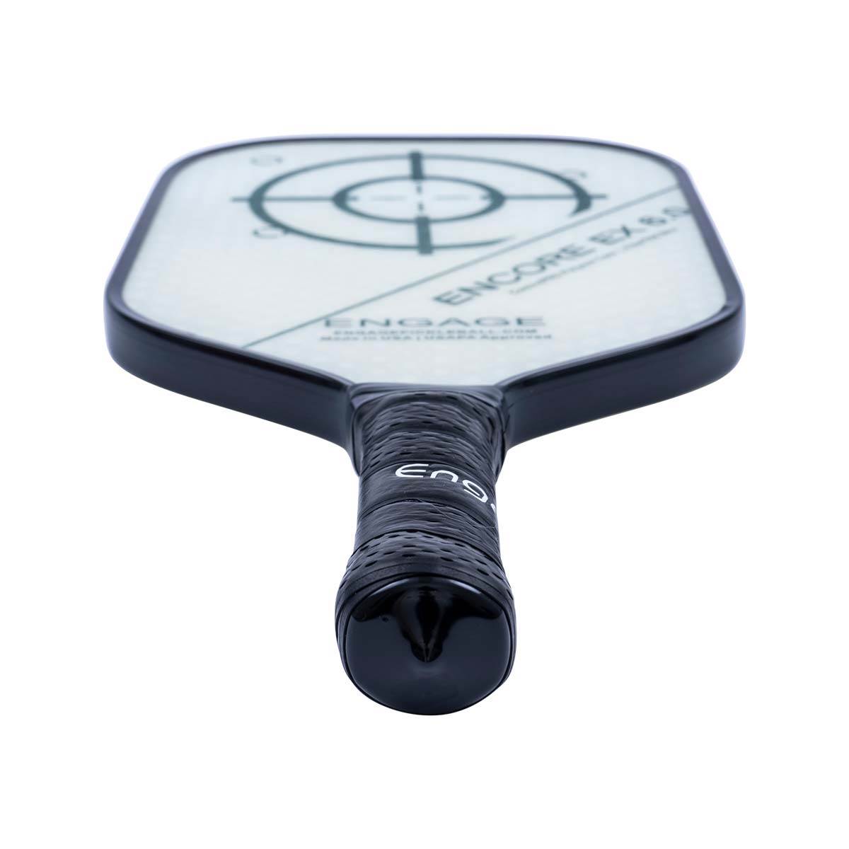 Top-down view of a black pickleball paddle with a white face, target design, and Engage branding on the grip.