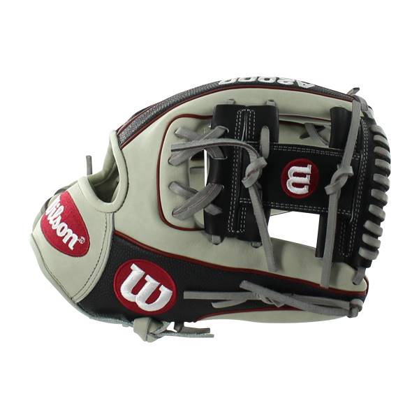Side view of a cream and black baseball glove with red Wilson branding and grey lacing.