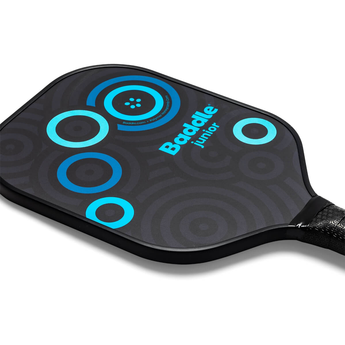 Top-down view of a black Baddle Junior pickleball paddle with blue concentric circles and target design.