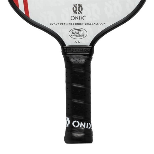 Close-up of a black pickleball paddle grip with ONIX branding and USA Pickleball Approved seal.