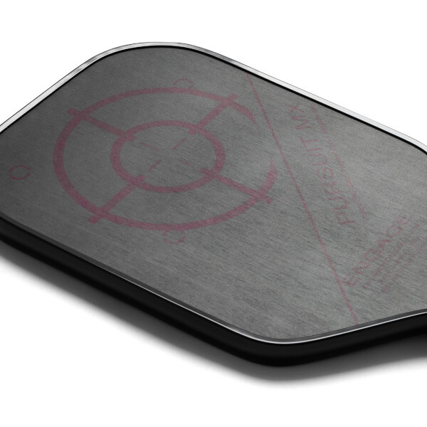 Top-down view of a gray pickleball paddle with a pink target design and visible text.