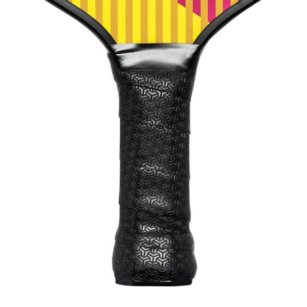 Close-up of a black pickleball paddle grip with a textured geometric pattern and yellow and pink stripes on the paddle head.