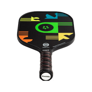 Front view of a black pickleball paddle with colorful geometric shapes and a red-striped grip.
