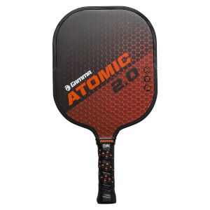 Front view of a black and orange pickleball paddle with GAMMA ATOMIC 2.0 text and honeycomb pattern.