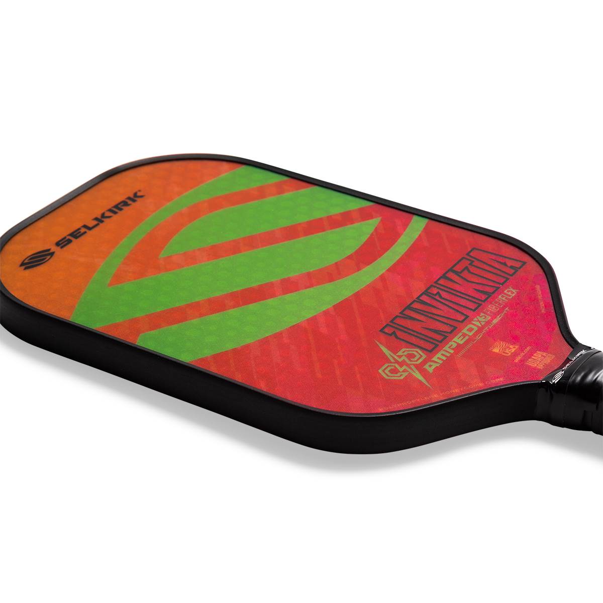 Top-down view of a red and orange pickleball paddle with green stripes, Selkirk logo, and INVIKTA AMPED text.