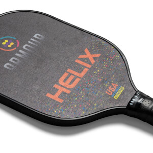 Top-down view of a black pickleball paddle with orange HELIX text, colorful speckles, and USA Pickleball Approved logo.