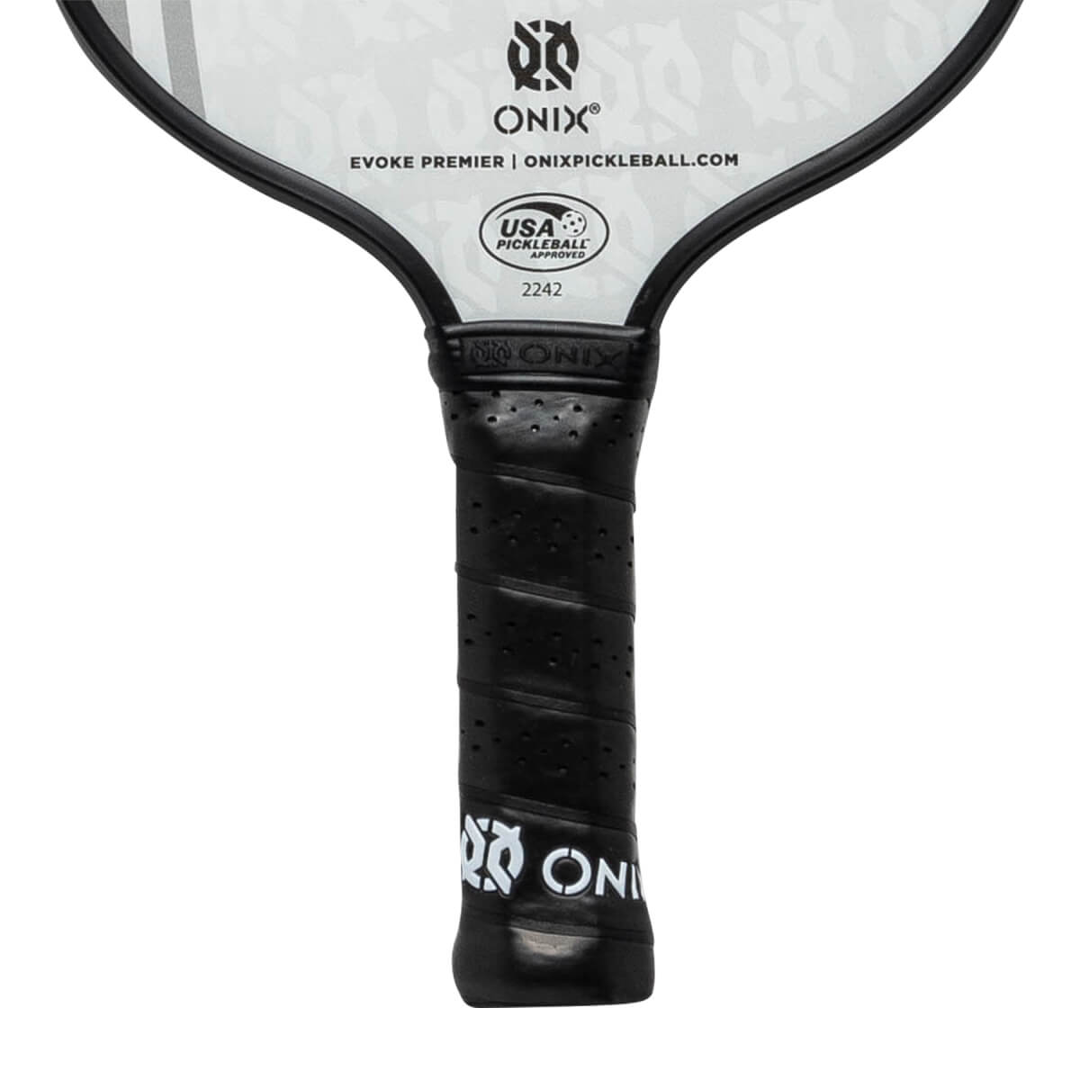 Close-up of a black pickleball paddle grip with perforated texture and ONIX branding.
