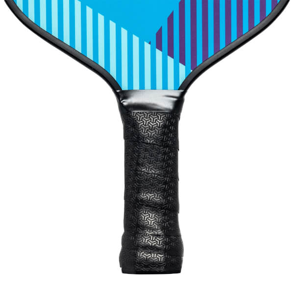 Close-up of a black pickleball paddle grip with a geometric pattern and a blue and purple striped paddle head.