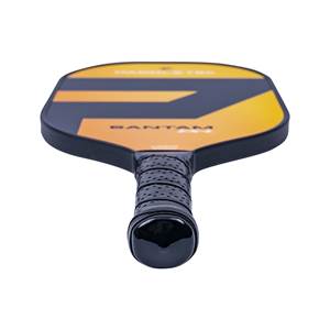 Top-down view of a black and orange pickleball paddle with BANTAM EX-L text and a perforated grip.