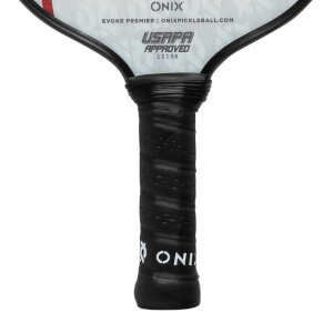 Close-up of a black pickleball paddle grip with perforations and the ONIX logo.