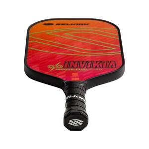 Top-down view of a red and orange pickleball paddle with INV IKTA and SELKIRK branding.