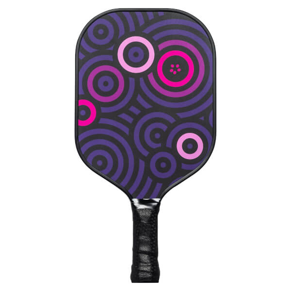 Front view of a purple pickleball paddle with a concentric circle pattern and black grip.
