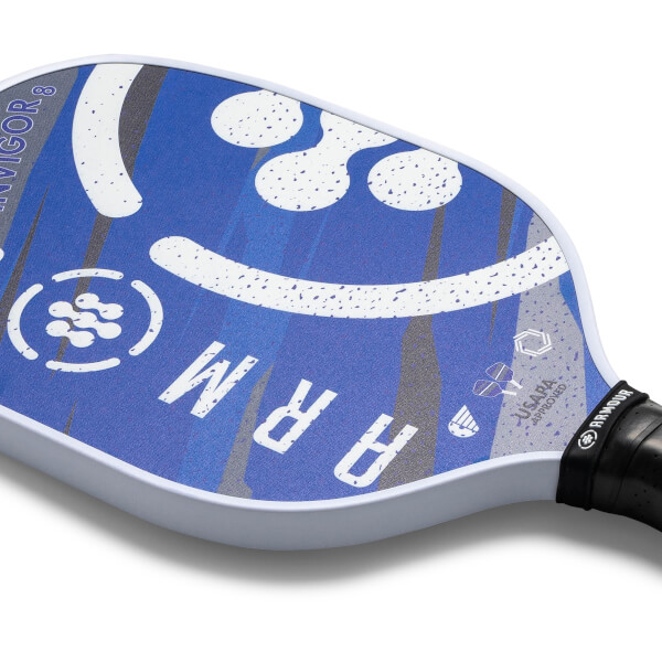 Close-up of a blue pickleball paddle with white speckles, the word ARM and USAPA approved logo.
