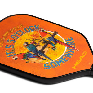 Corner view of an orange pickleball paddle with parrots, a guitar, and ITS 5 OCLOCK SOMEWHERE text.