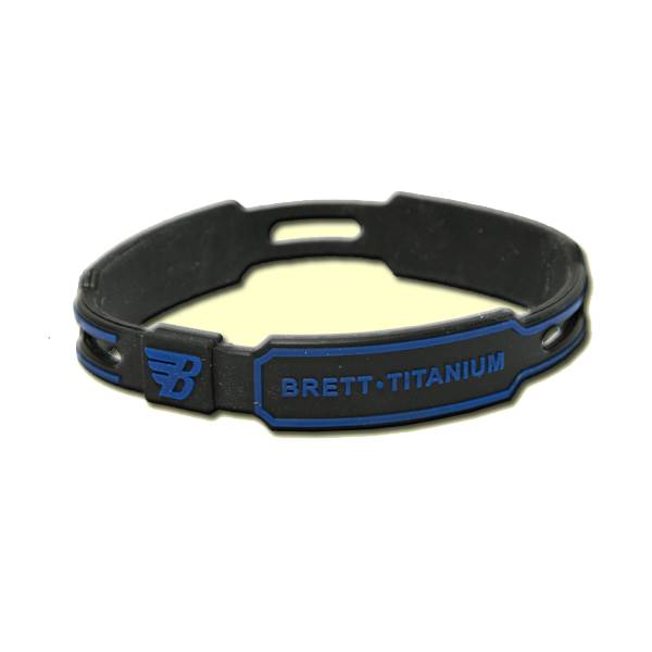 Close-up of a black bracelet with blue accents and BRETT TITANIUM text.