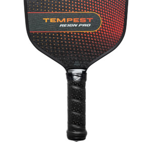 Top-down view of a black pickleball paddle with TEMPEST REIGN PRO text and a gradient orange and black pattern.