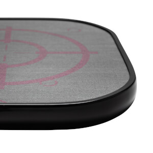 Corner view of a grey pickleball paddle with a pink target design and black edge.