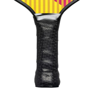 Close-up of a black pickleball paddle grip with a textured geometric pattern and yellow and pink stripes on the paddle head.