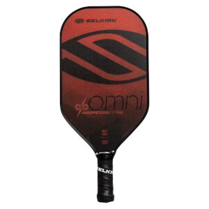 Front view of a red and black pickleball paddle with a large S graphic, omni text, and Selkirk branding.