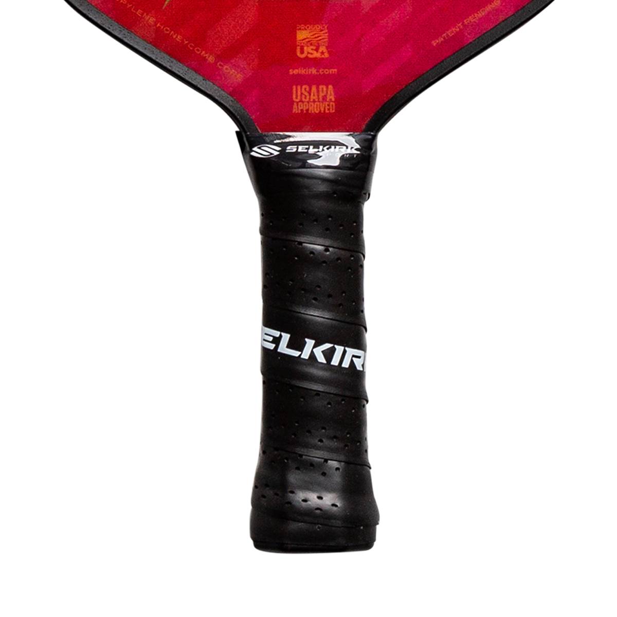 Close-up of a black pickleball paddle grip with ELKIR branding and perforated texture.