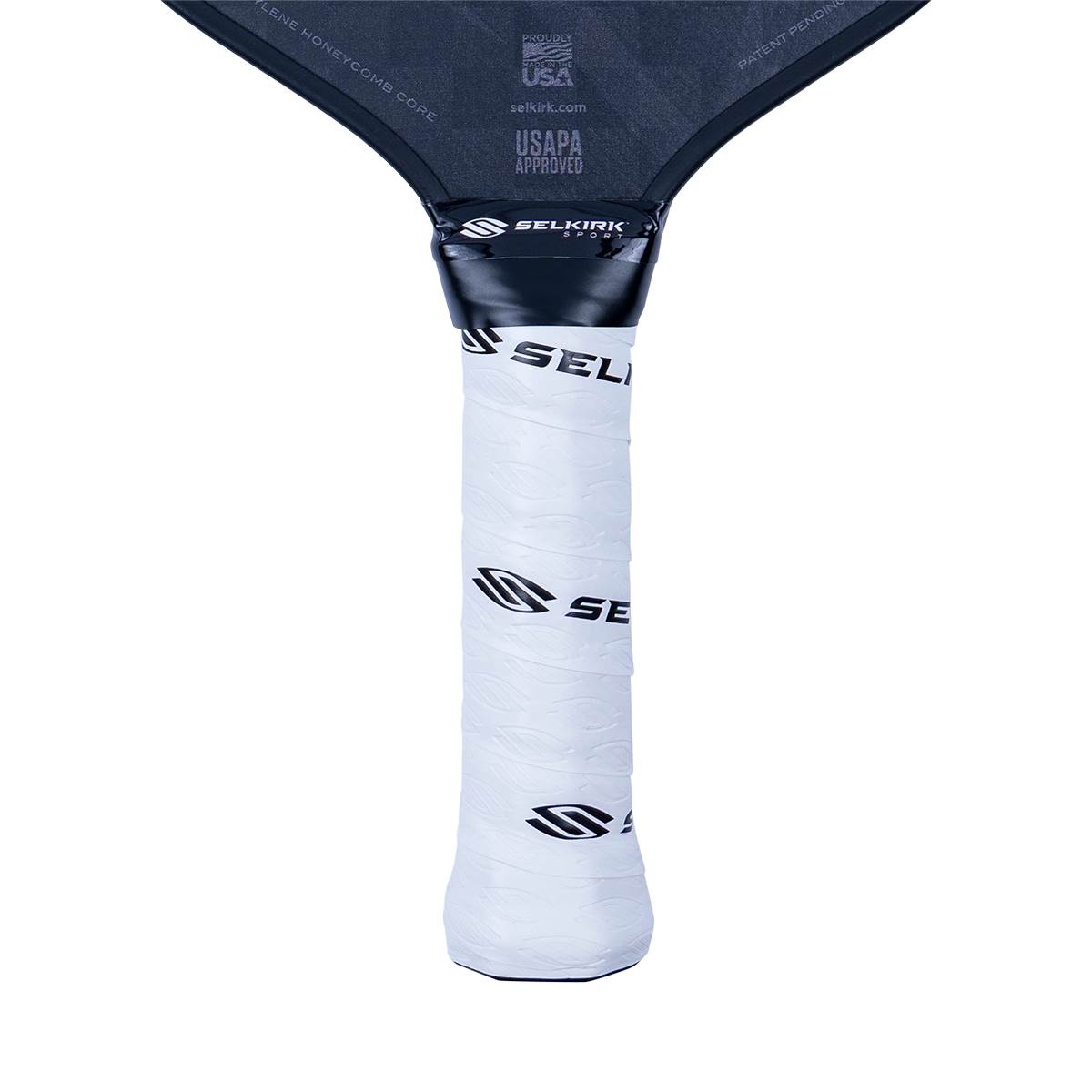Close-up of a white pickleball paddle grip with black Selkirk branding and USAPA approved text.