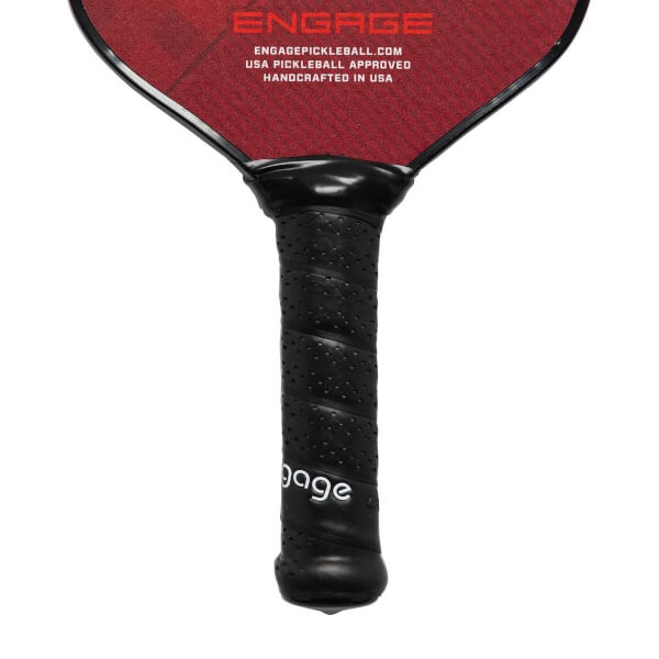 Close-up of a black pickleball paddle grip with perforations and white engage text.
