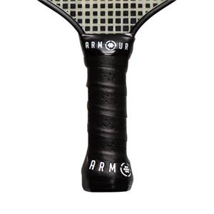Close-up of a black pickleball paddle grip with ARMOUR and ARM logos.