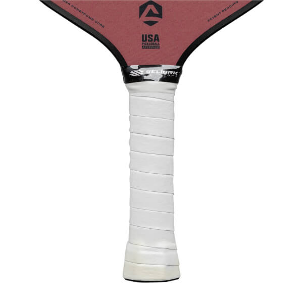 Top-down view of a red pickleball paddle with a white grip and USA Pickleball Approved logo.