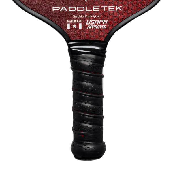 Close-up of a black pickleball paddle grip with red stitching and PADDLETEK branding.
