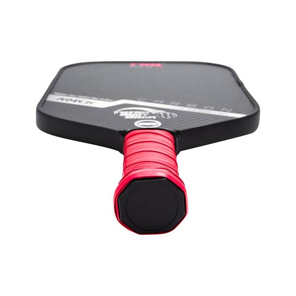 Top-down view of a black pickleball paddle with a red grip and CARBON text.