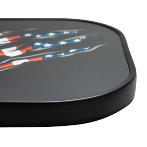 Close-up of a black pickleball paddle with a ripped American flag graphic.