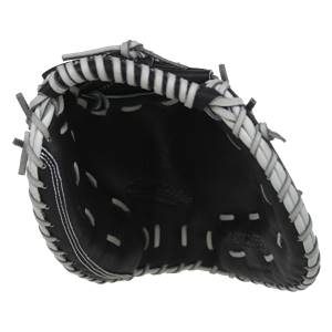 Interior view of a black catchers mitt with white lacing and AKDEMAR embossed on the palm.
