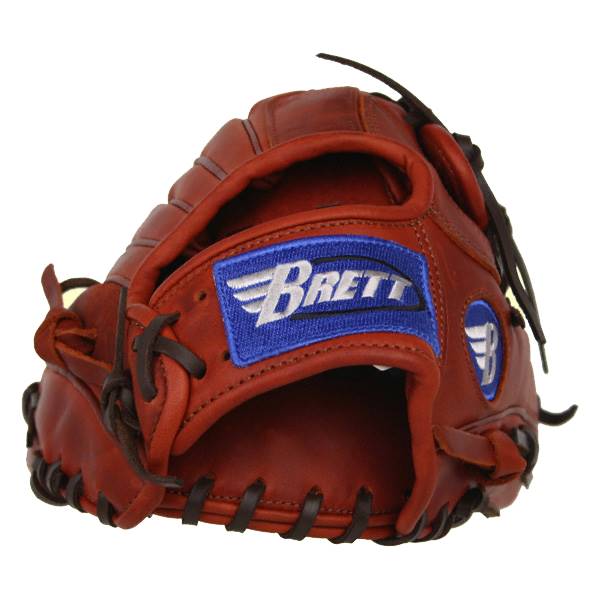 Close-up of a brown baseball glove with a blue BRETT patch and lacing.