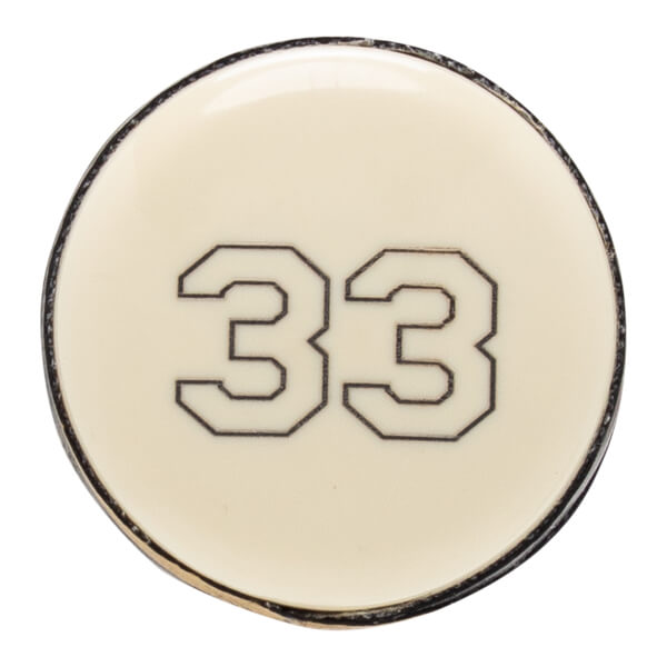 Top-down close-up of an off-white baseball bat end cap with the number 33 printed in black.