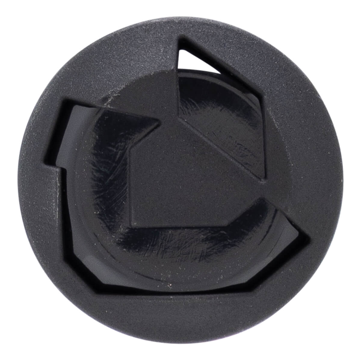 Close-up of a black bat end cap with a circular shape, raised geometric design, and textured outer ring.