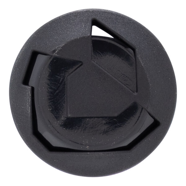 Close-up of a black bat end cap with a circular shape, raised geometric design, and textured outer ring.