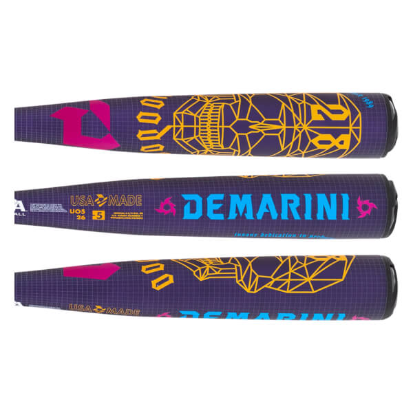 Side view of a purple baseball bat with a yellow geometric skull design and blue DEMARINI text.