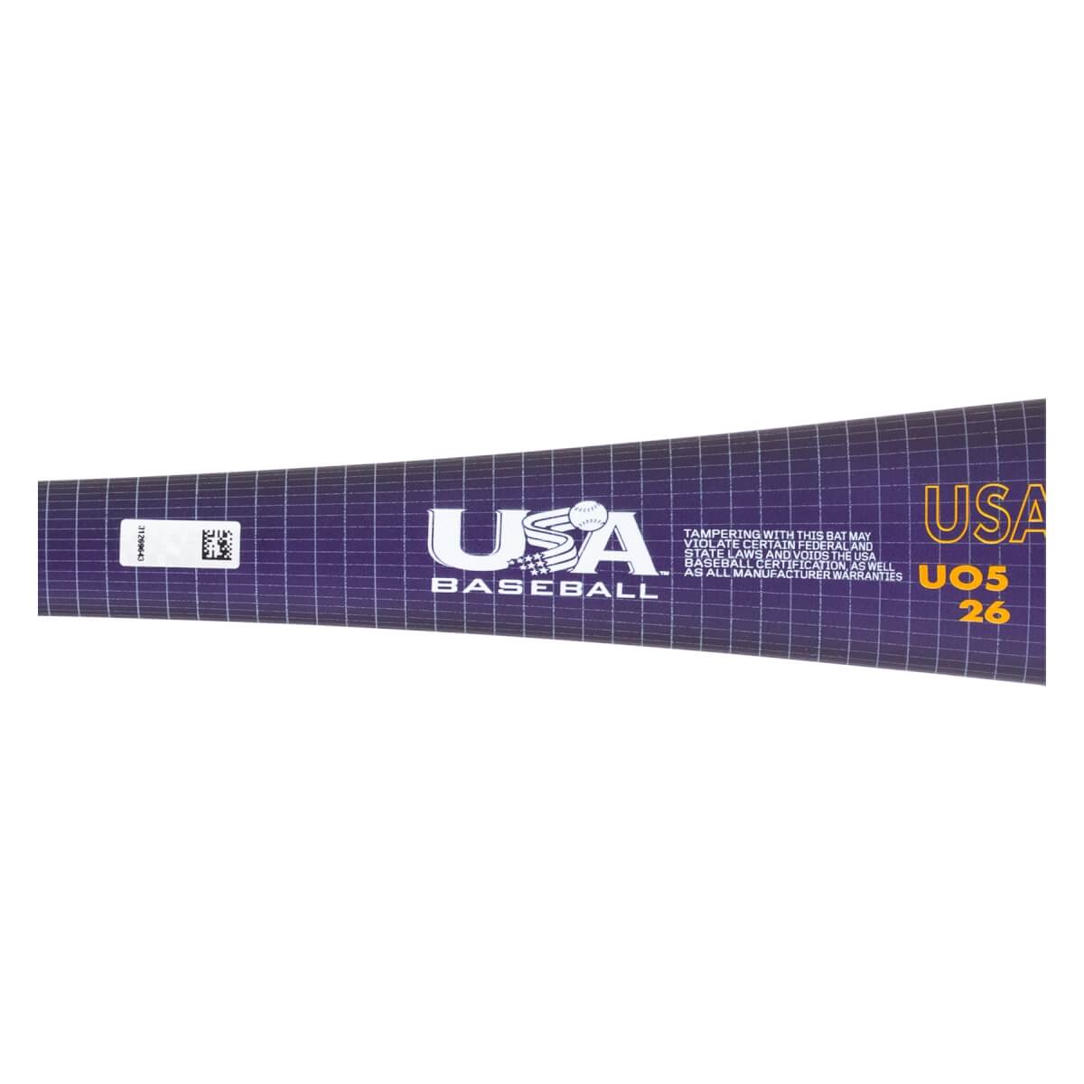 Close-up of a purple baseball bat with a grid pattern, featuring the USA Baseball logo, USA UO5 26 text, and a white barcode sticker.