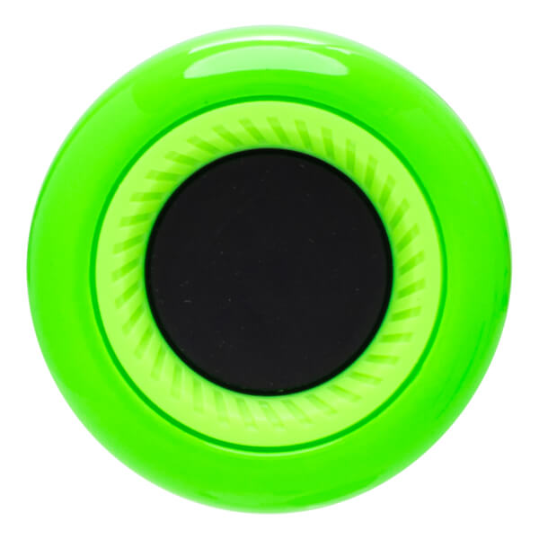 Top-down view of a bright green circular object with a black center and textured concentric rings.
