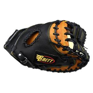 Top-down view of a black and tan catchers mitt with yellow stitching and a Brett logo.