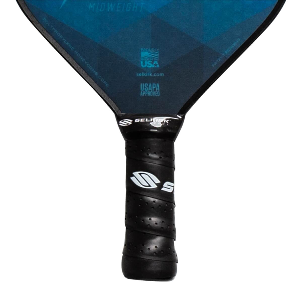 Close-up of a black pickleball paddle grip with Selkirk branding and USAPA approved label.