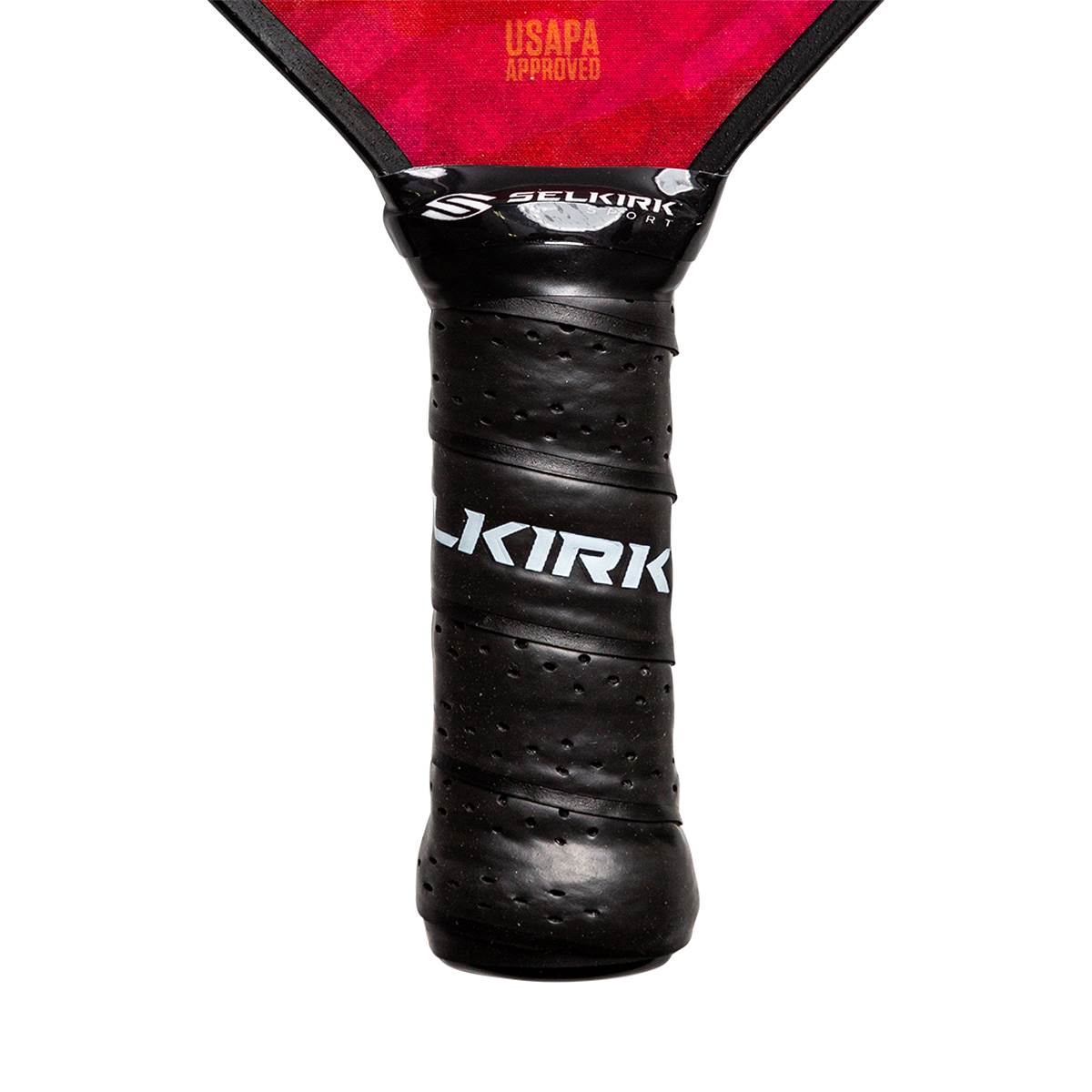 Close-up of a black pickleball paddle grip with KIRK branding and perforated texture.