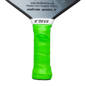 Close-up of a bright green grip on a pickleball paddle with TSD logo and Third Shot Drop text.