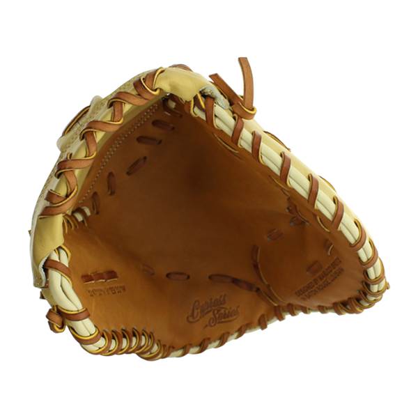 Top-down view of a tan and cream first base mitt with brown lacing and Cypress Series text.