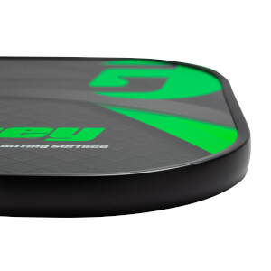 Corner view of a black pickleball paddle with green Gamma logo and Hitting Surface text.