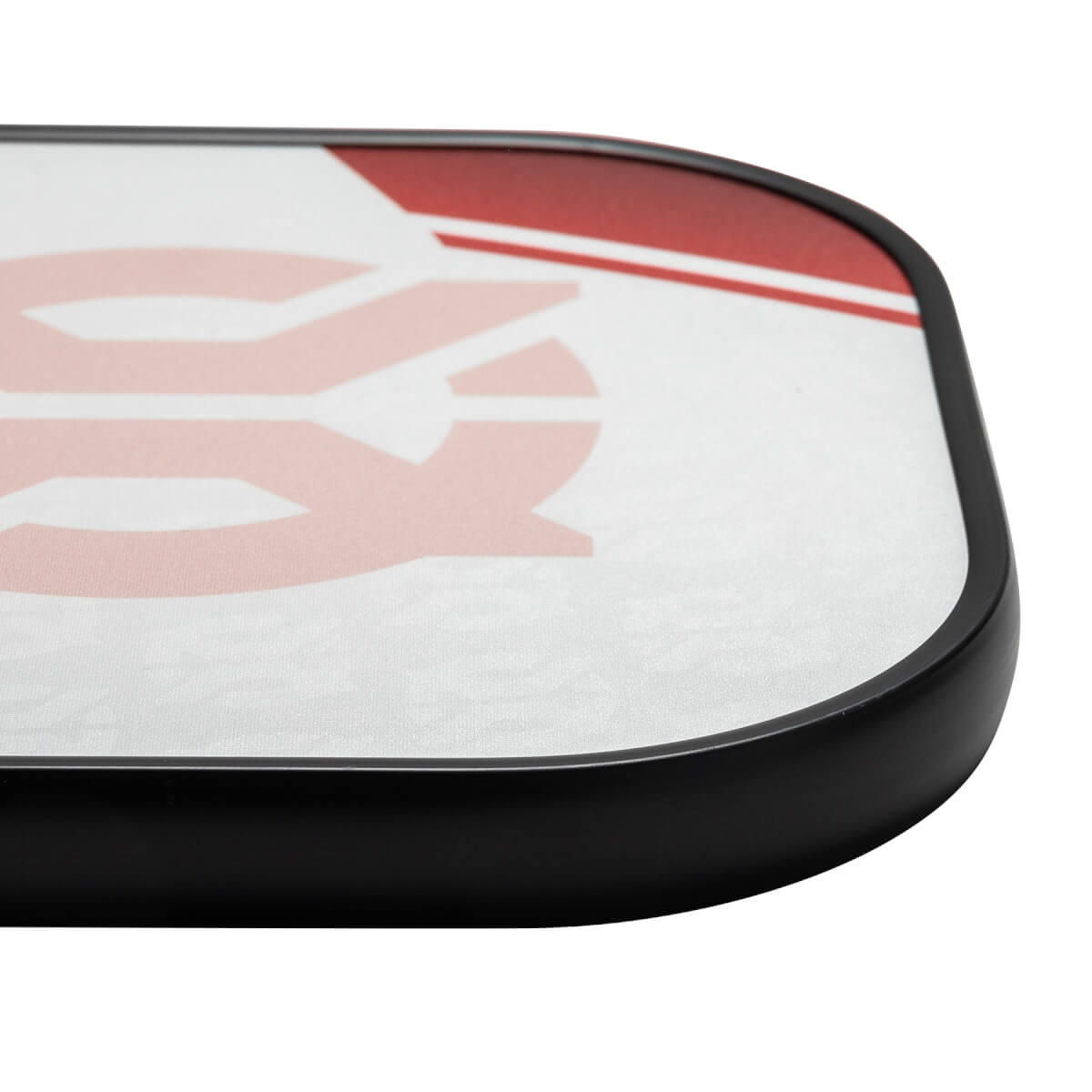 Corner view of a white pickleball paddle with a red graphic and black edge.