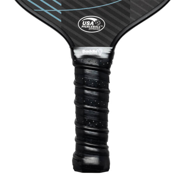 Close-up of a black pickleball paddle grip with Baddle branding and USA Pickleball Approved logo.
